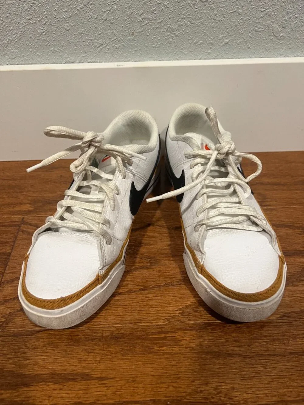 Nike Court Legacy White Sneakers with Black Swoosh and Tan Accent
